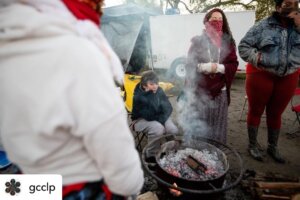 Gathering around fire, during Sacred Waters Pilgrimage